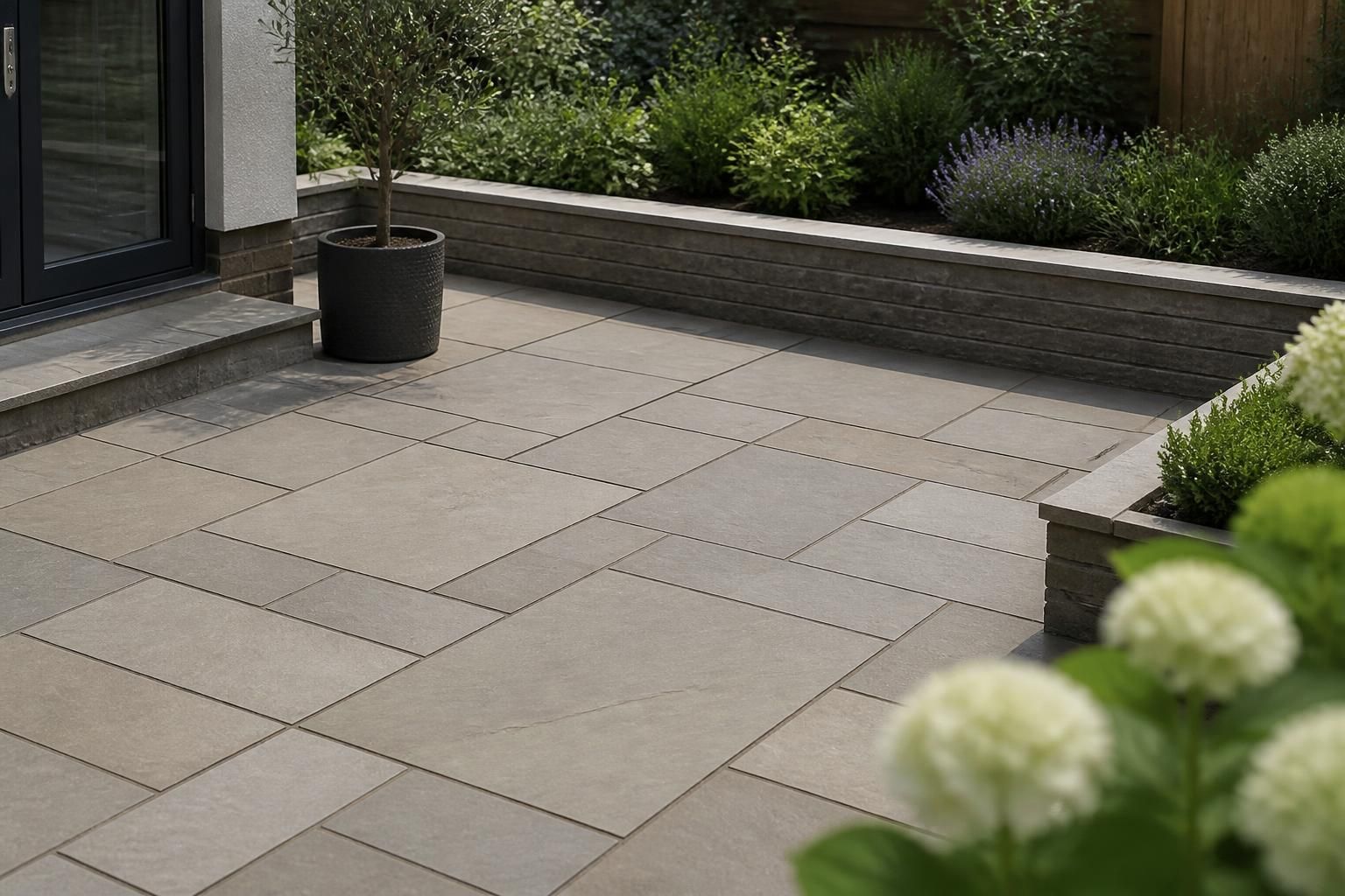 Finished patio installation with clean stone paving and crisp joints.